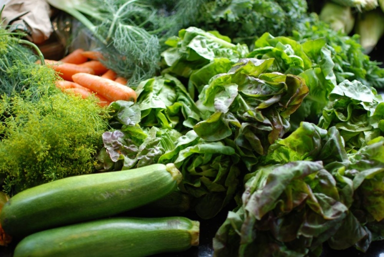fresh leafy vegetables and carrots